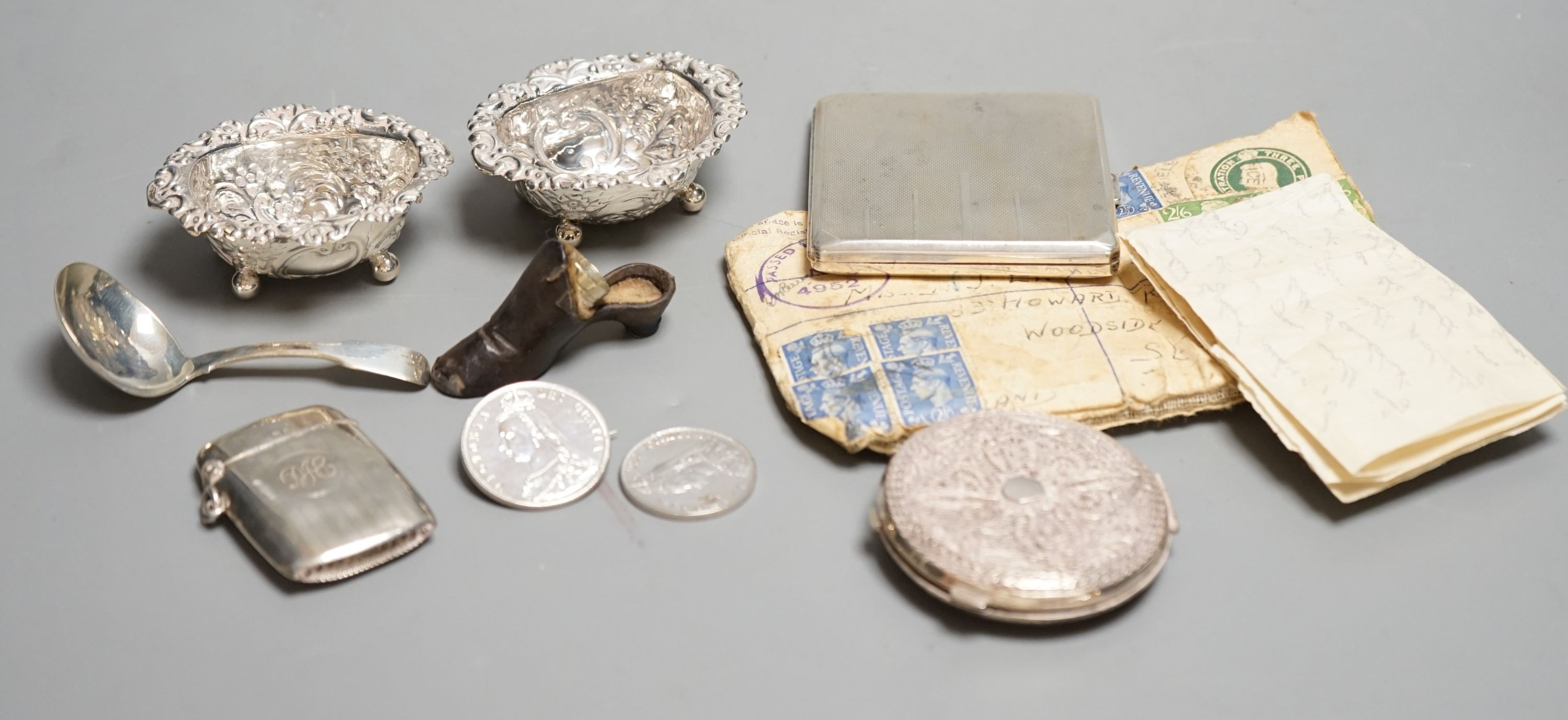 A silver cigarette case, Georgian silver caddy spoon, London, 1817, a pair of silver salts, etc.